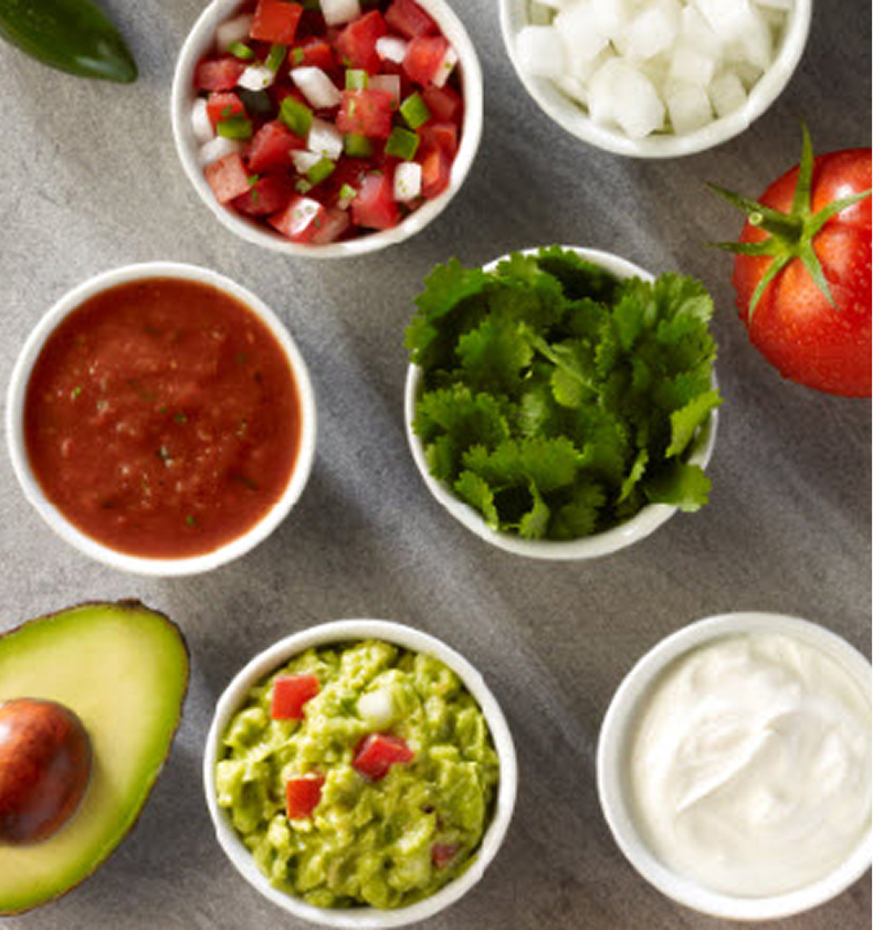 Fresh salsa, guacamole, cilantro, avocado, and crema.